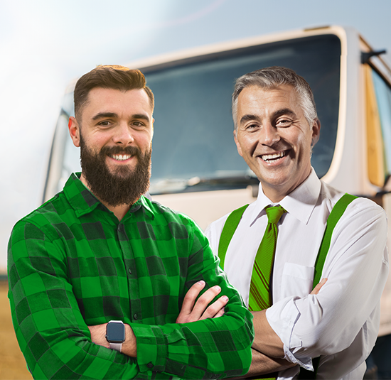 Carrier and friendly banker stand smiling in front of a lorry